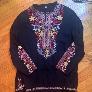 Embroidered black top. NWOT